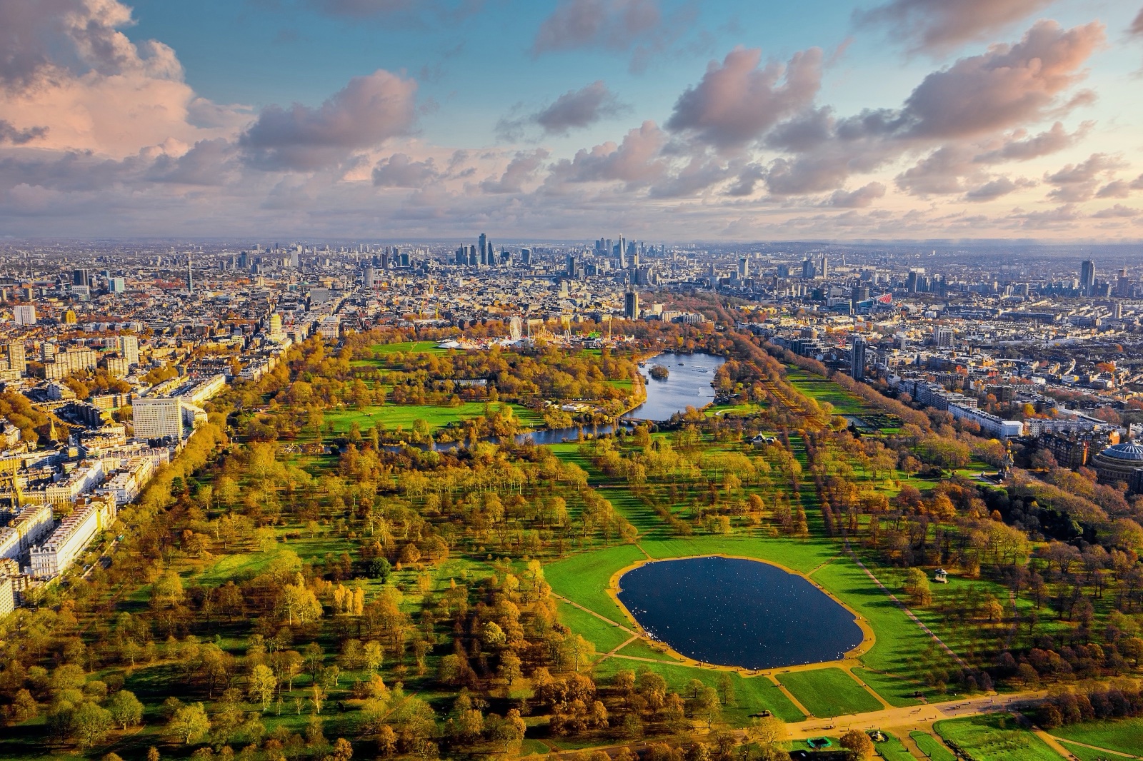 Aerial view of Hyde Park and the London skyline at sunset